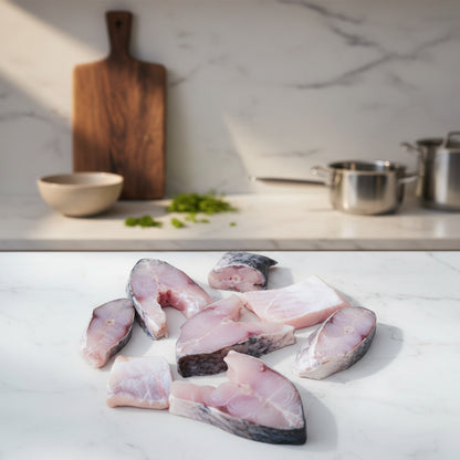 Fresh Catla Bengali‑cut fish pieces displayed on a clean, elegant background with nutrient icons and premium taglines, highlighting hygiene, freshness, and FISHNESS safe‑food quality standards