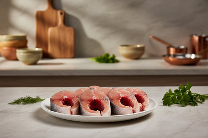 “Fresh Rohu fish steaks arranged neatly on a clean plate, showcasing natural pinkish‑white texture, circular steak cuts, and VTF’s premium hygienic preparation.”